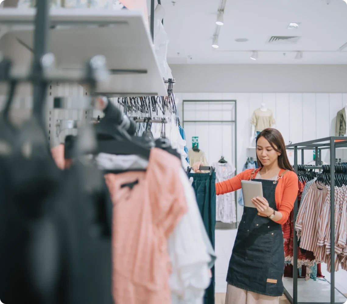 Retail employee looking through inventory