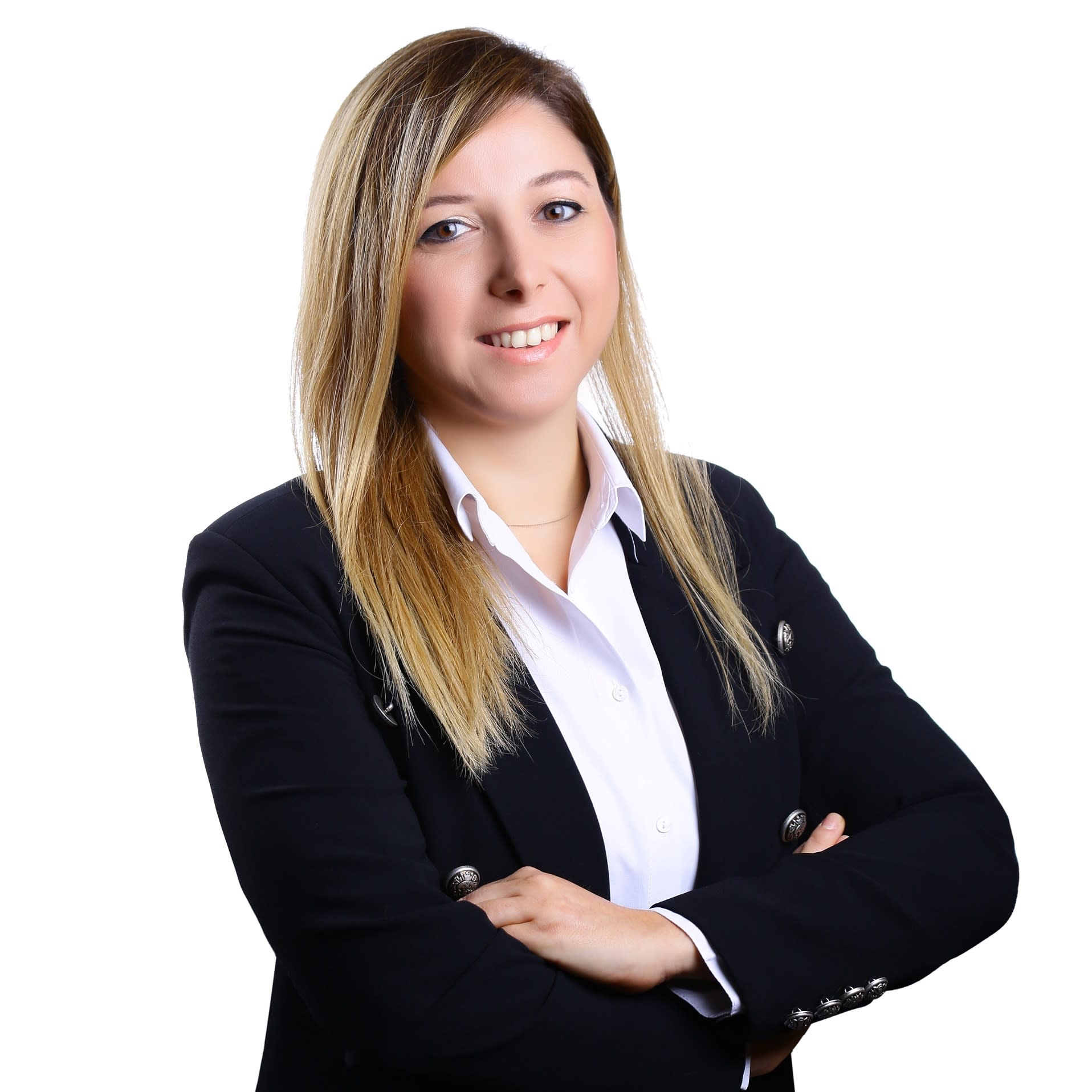 Headshot of blog author, Bahar Erol Ceren. She has long blond hair, wearing a black blazer with a white button-up shirt, and is smiling in front of a plain white background.