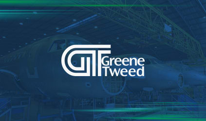 Greene Tweed logo overlaid on an image of an aircraft manufacturing facility.