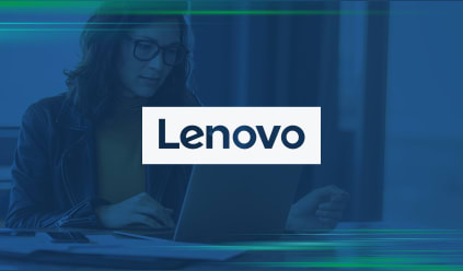 Person using a laptop with the Lenovo logo overlayed in the center.